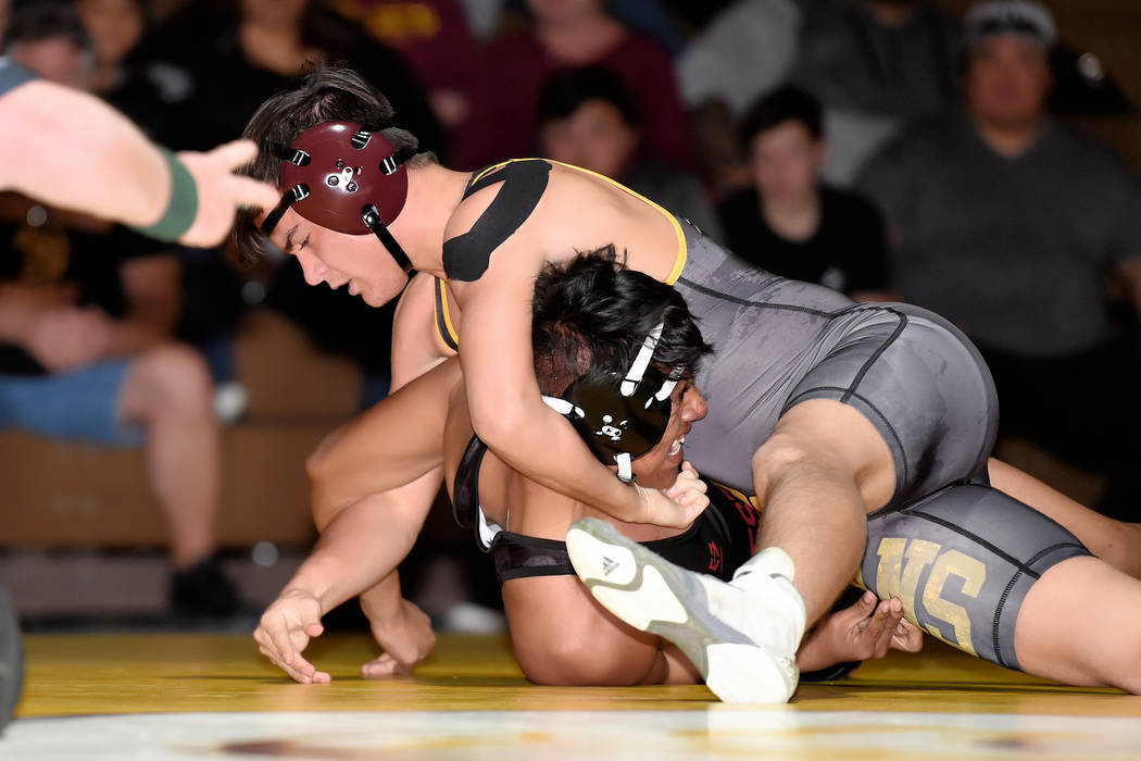 Peter Davis/Special to the Pahrump Valley Times Pahrump Valley senior Dylan Grossell battles Western freshman Jesus Perez at 152 pounds on Wednesday night in Pahrump. Grossell recorded a second-pe ...
