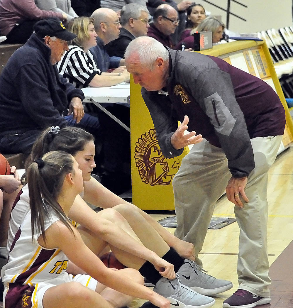Horace Langford Jr./Pahrump Valley Times While Pahrump Valley girls basketball coach Bob Hopkins talks to his players, sports editor Tom Rysinski and everyone else at the scorer's table have their ...
