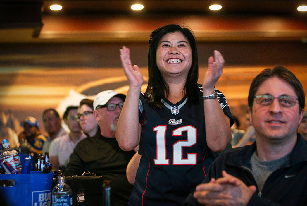 People react as they watch Super Bowl LIII at the Westgate Superbook in Las Vegas in Las Vegas, Sunday, Feb. 3, 2019. (Caroline Brehman/Las Vegas Review-Journal)