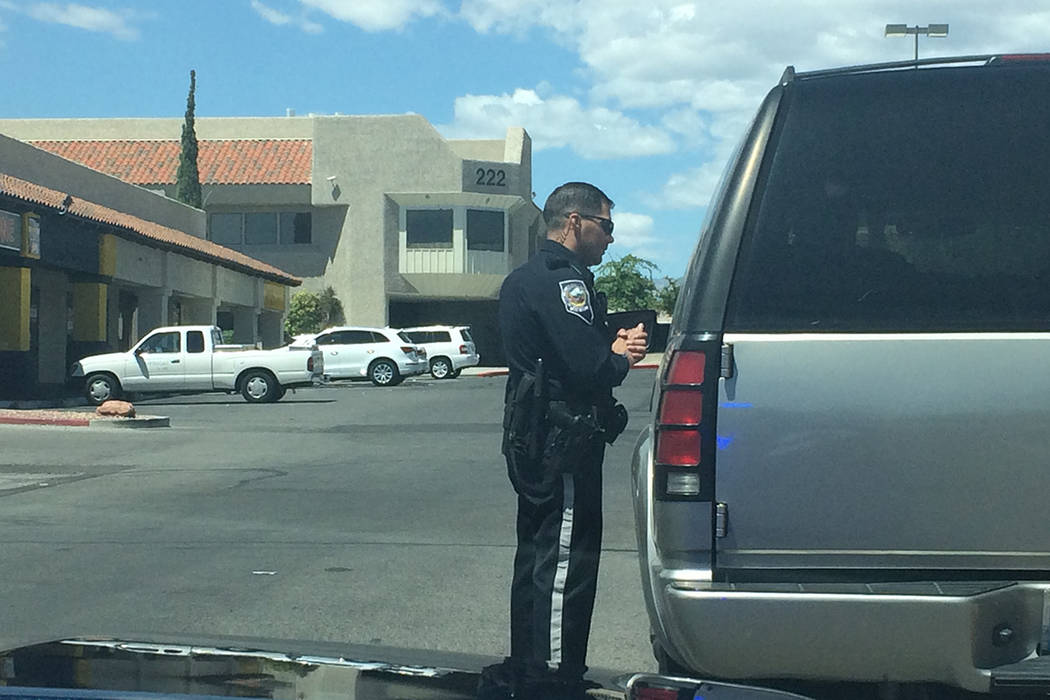 Nevada Highway Patrol trooper Sam Acosta is seen speaking with a driver after pulling him over on Monday, May 16, 2016. (Lawren Linehan/Las Vegas Review-Journal)