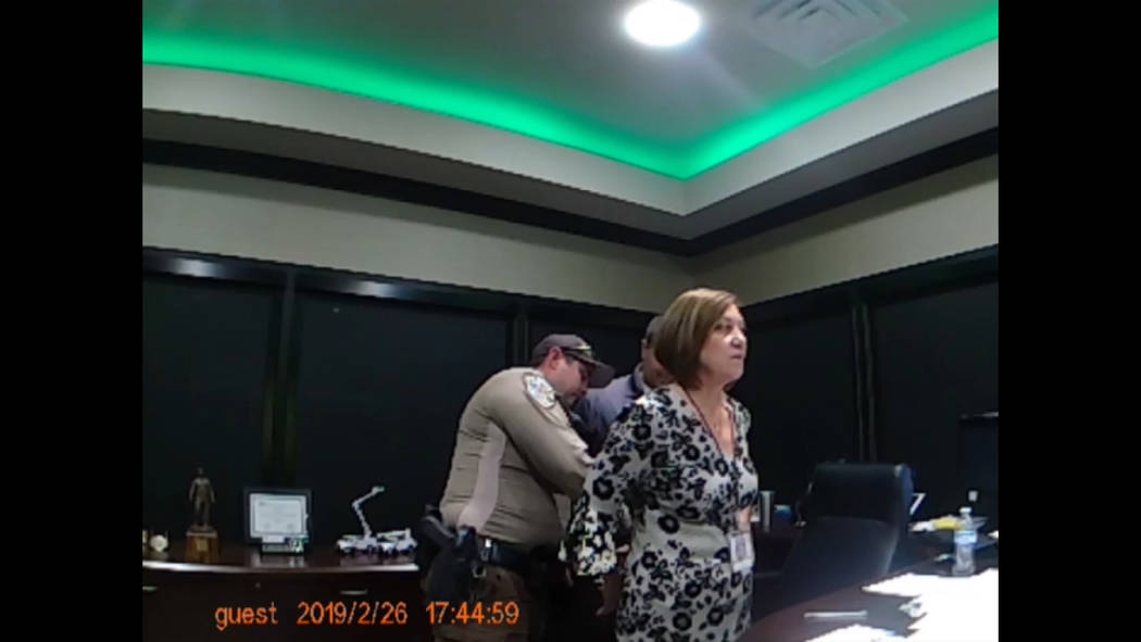 Nye County Sheriff's Office video screenshot Nye County Sheriff's Office body-cam footage show Valley Electric Association CEO Angela Evans being arrested at the co-op's administrative offices at ...
