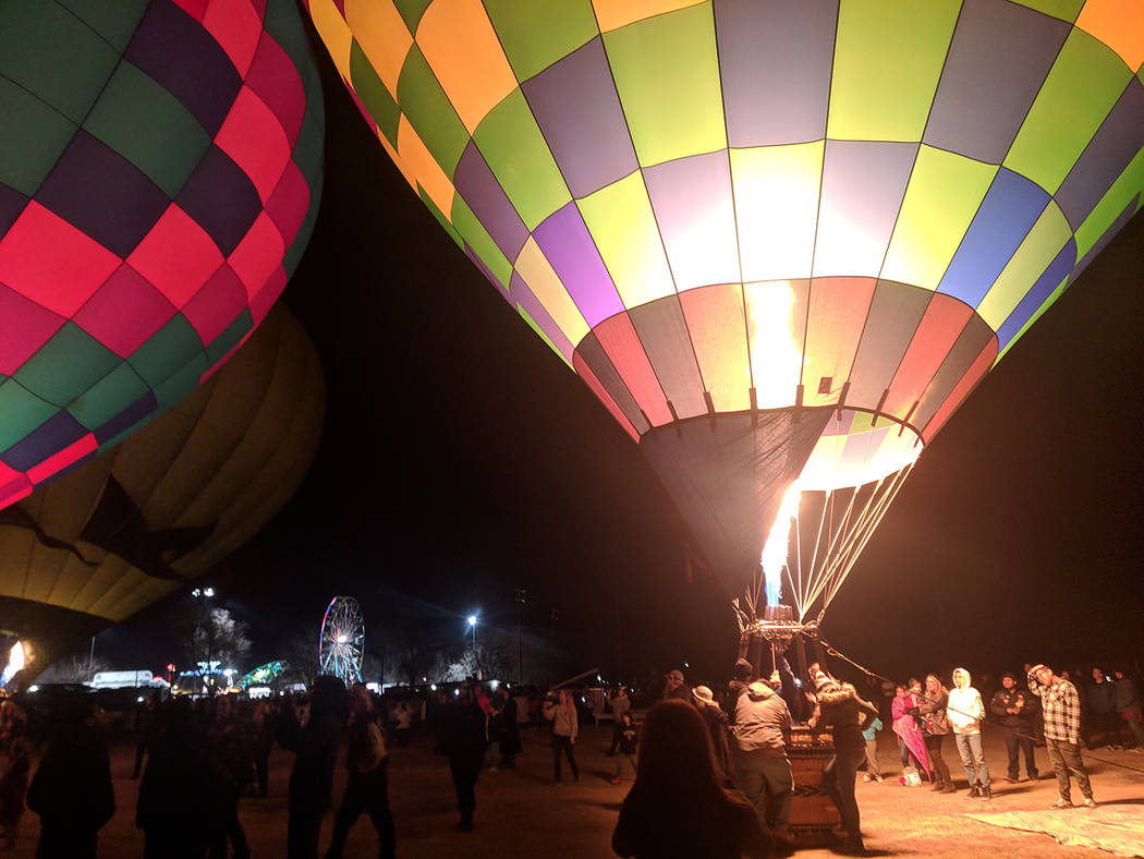Jolina Mackool/Special to the Pahrump Valley Times Jets of flame lit up the dark night at the Balloon Glow, where several hot air balloons were set up for an amazing light show. Huge crowds gather ...