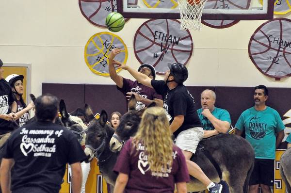Horace Langford Jr./Pahrump Valley Times It's On Like Donkey Kong, in black, a team representing the Pahrump Chamber of Commerce, competes against a team made up of Pahrump Valley High School facu ...