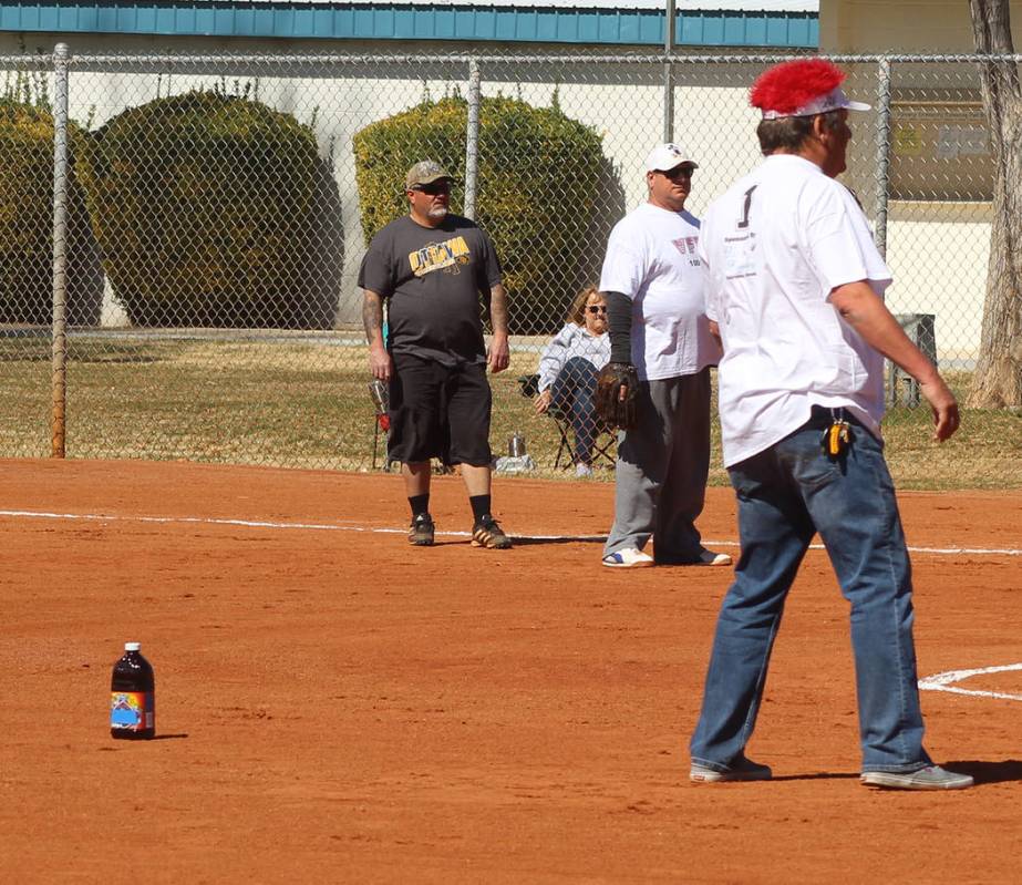 Tom Rysinski/Pahrump Valley Times Pahrump Youth Softball Association players graciously provided VFW/VFW Auxiliary shortstop K.C. Connell with a bottle of prune juice to help him keep his, um, adr ...