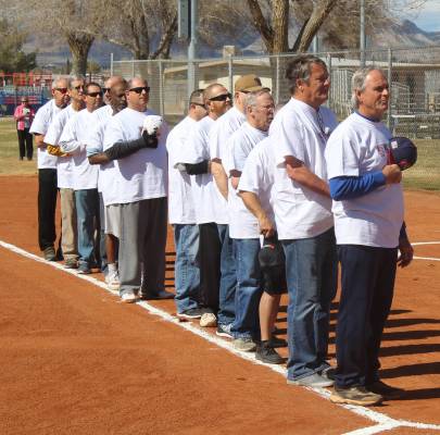 Tom Rysinski/Pahrump Valley Times Players from the VFW/VFW Auxiliary team line up along the first base line for the Pledge of Allegiance before the Batting 1.000 Challenge against the Pahrump Yout ...