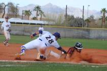 Charlotte Uyeno/Pahrump Valley Times Pahrump Valley's Jalen Denton dives safely back to first base during the Trojans' 5-1 loss to Southwest, California, in the Route 66 Tournament on Saturday in ...