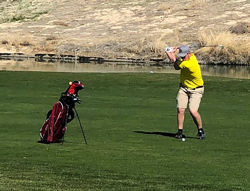 Tom Rysinski/Pahrump Valley Times Koby Lindberg of Pahrump Valley takes his second shot on the 9th hole at Mountain Falls Golf Club on Friday during the second round of the Pahrump Valley Invitati ...