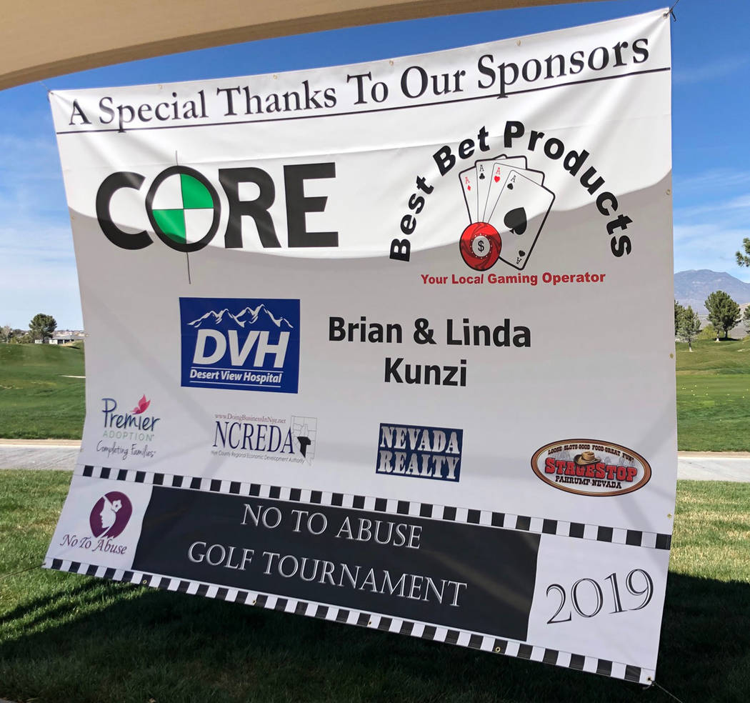 Tom Rysinski/Pahrump Valley Times Sponsors of the annual No To Abuse Golf Tournament are thanked on a banner hung Saturday outside the clubhouse at Mountain Falls Golf Club in Pahrump.