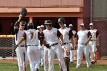 Horace Langford Jr./Pahrump Valley Times Sophomore Jalen Denton is greeted by teammates at home plate after leading off the game with a home run Monday against Boulder City in Pahrump.