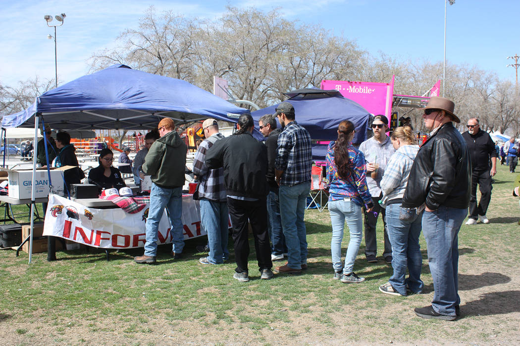 Robin Hebrock/Pahrump Valley Times This file photo shows patrons of the 6th Annual Silver State Chili Cook-off at the information booth where event staffers were selling the tasting tickets and pa ...