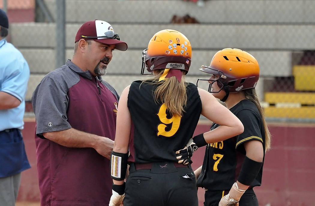 Horace Langford Jr./Pahrump Valley Times Assistant coach Rich Lauver talks with Skyler Lauver (9) and Ally Rily (7) during Pahrump Valley's 14-10 victory over Boulder City on Monday in Pahrump.
