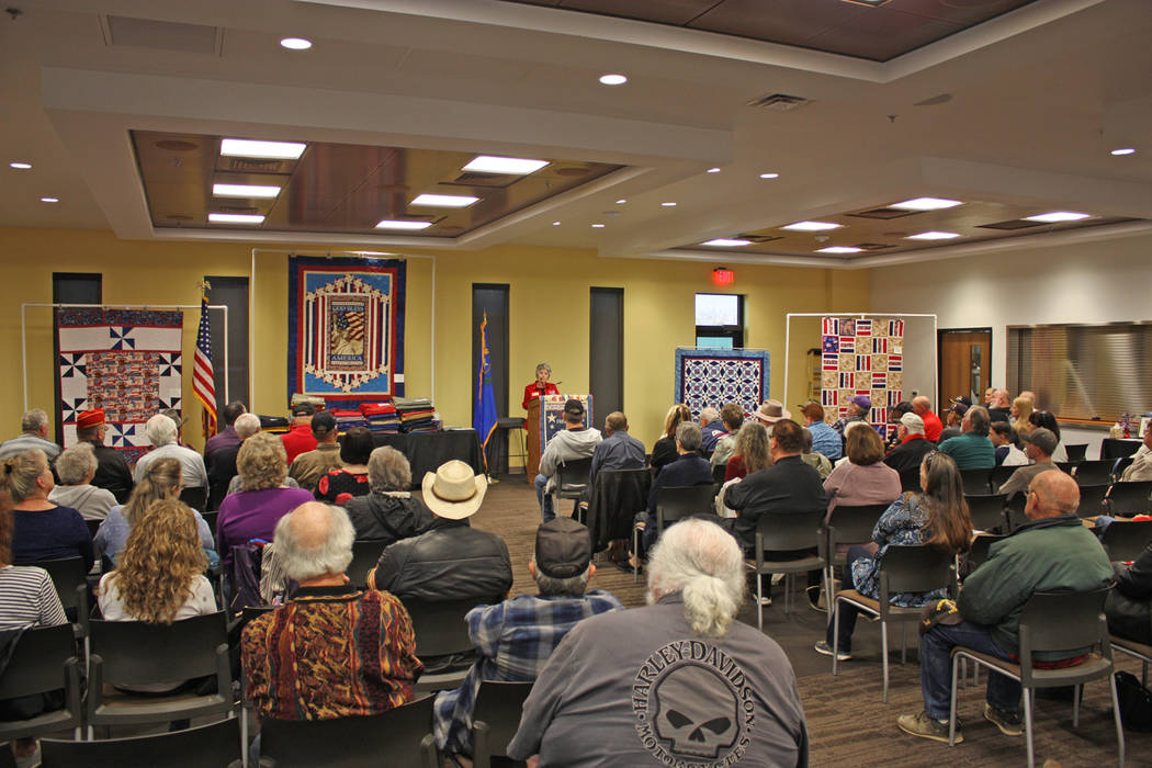 Robin Hebrock/Pahrump Valley Times Nye County Valor Quilters Group Leader Elba Rocha addresses the large crowd gathered for the March presentation ceremony.