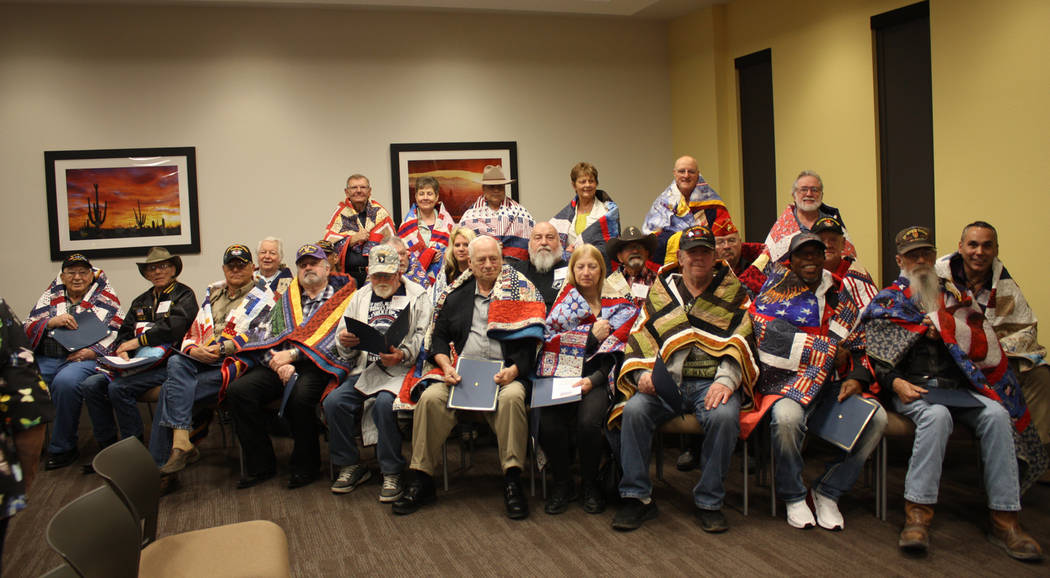 Robin Hebrock/Pahrump Valley Times More than two dozen area veterans were honored with their own specially made Quilts of Valor during the Nye County Valor Quilters' March 2 presentation ceremony.