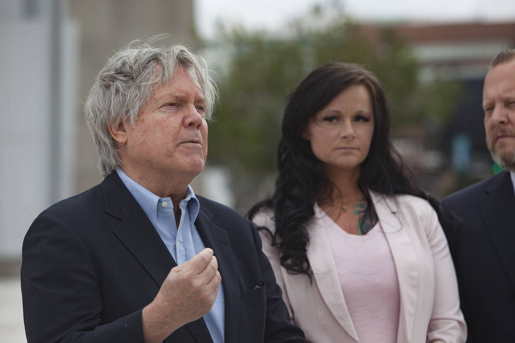 Attorney and Clark County Commissioner Tick Segerblom addresses media alongside his client Jennifer Glover outside the federal court house in Las Vegas, Monday, March 11, 2019. Glover is a former ...