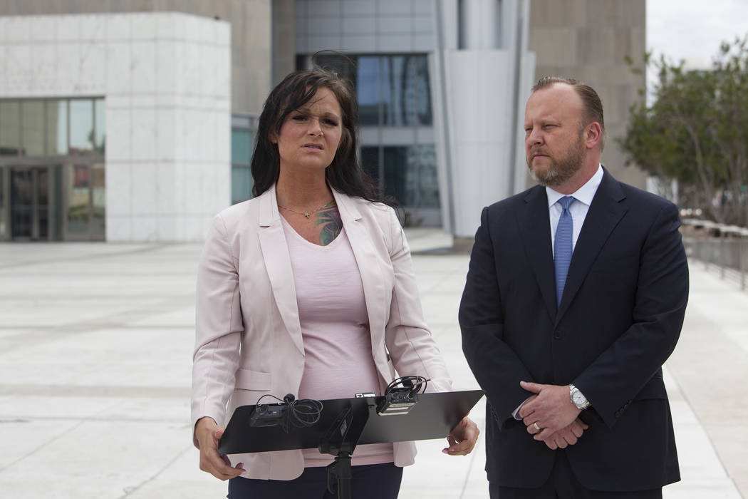 Jennifer Glover addresses the media next to her attorney Jay Ellwanger outside the federal court house in Las Vegas, Monday, March 11, 2019. Glover is a former Nevada National Security Site employ ...