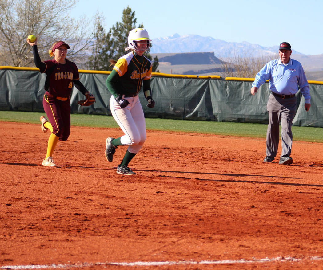 Special to the Pahrump Valley Times Pahrump Valley junior Skyler Lauver chases a Bonneville, Idaho, runner back to first base during the Trojans' 16-6 win over the Bees in the March Warm-Up Tourna ...