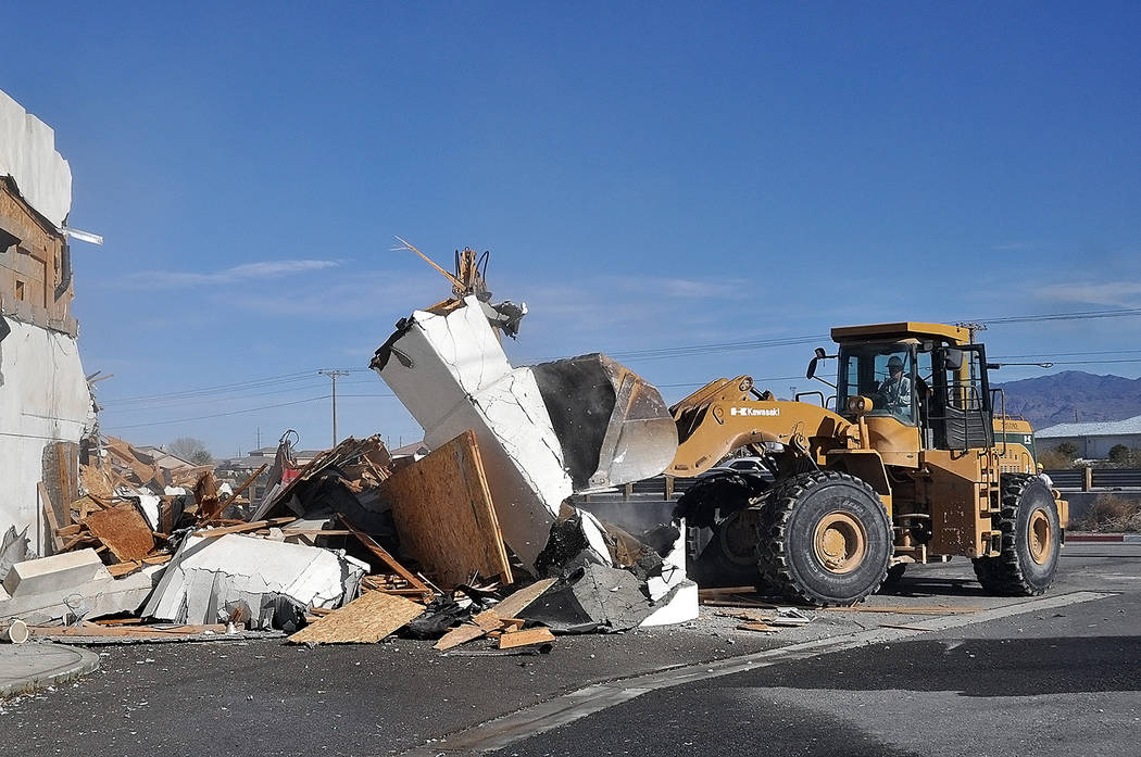 Horace Langford Jr./Pahrump Valley Times A bulldozer clears strewn debris from the former King ...