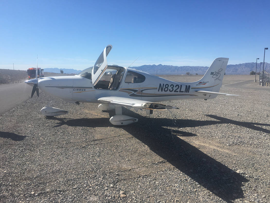 Selwyn Harris/Pahrump Valley Times The aircraft, an S-22 Cirrus clipped a stop sign at the entrance of the detention center, where a section of the plane's wing was torn off. The plane also sustai ...