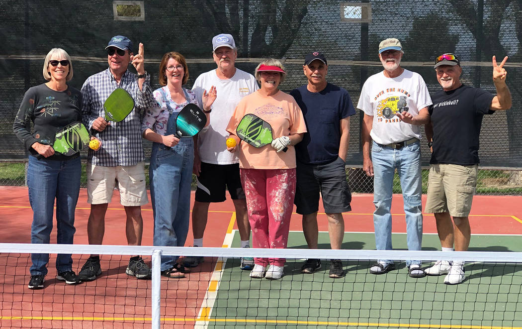 Tom Rysinski/Pahrump Valley Times Pickleball enthusiasts after they finished painting lines for ...