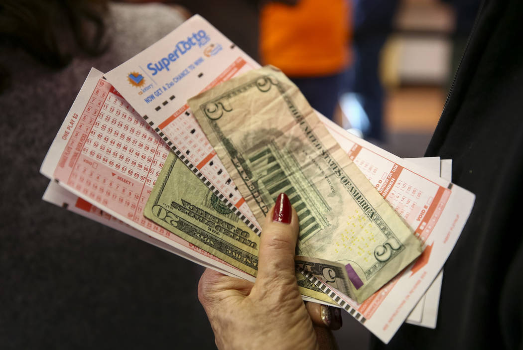 Richard Brian/Las Vegas Review-Journal A woman waits to buy lottery tickets at The Lotto Store at Primm just inside the California line next to the Primm Valley Casino Resorts in 2018.