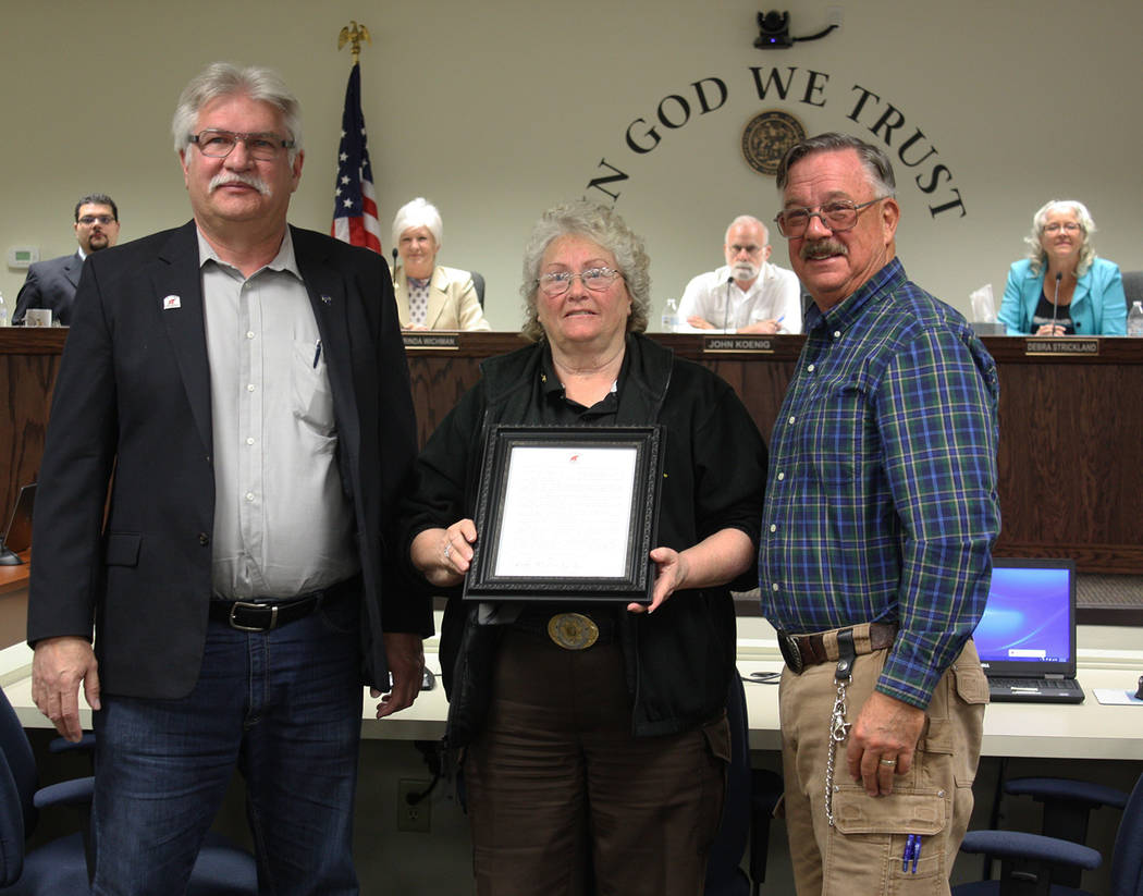 Robin Hebrock/Pahrump Valley Times Nye County Sheriff Sharon Wehrly, center, was also presented with a resolution from the Nye County Republican Central Committee for her public stance against leg ...