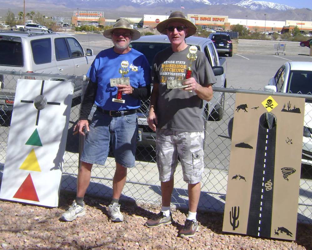 Mike Norton/Special to the Pahrump Valley Times Don Brown, left, and Dan Dunn won the Pahrump Dust Devils' inaugural cornhole tournament Saturday at Petrack Park, pocketing $50 apiece for their ef ...