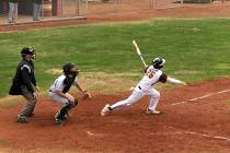 Tom Rysinski/Pahrump Valley Times Pahrump Valley senior Tyler Floyd watches his two-out RBI single in the seventh inning score Chase McDaniel with the winning run during the Trojans' 5-4 victory o ...