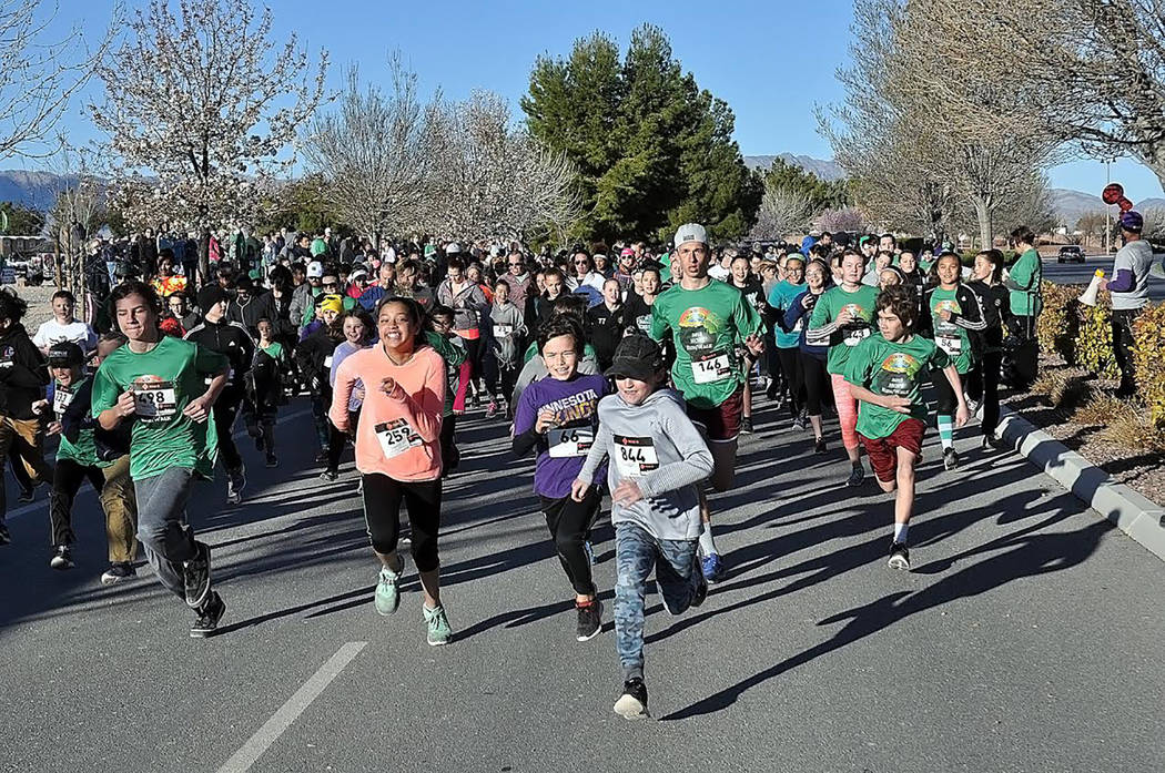 Horace Langford Jr./Pahrump Valley Times Participants in the 2018 HOPE Run/Walk a pictured making a mad dash from the starting line in this file photo. This year's event is set for March 30.