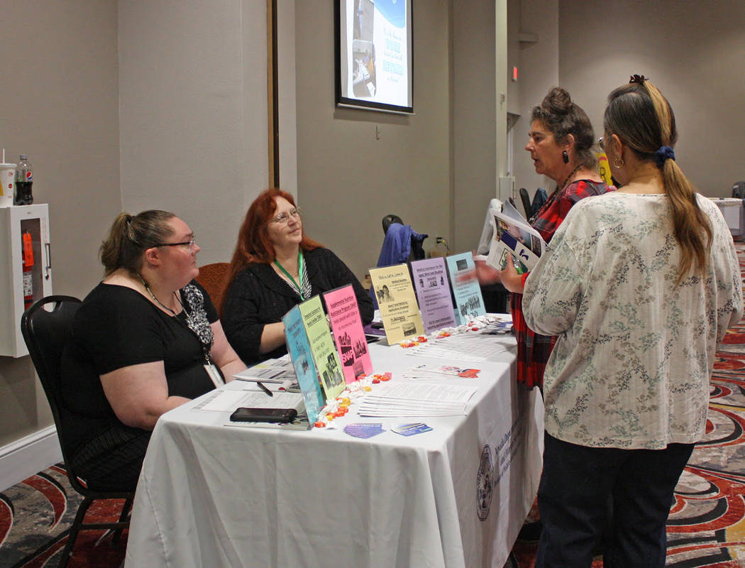 Robin Hebrock/Pahrump Valley Times Two health fair attendees chat with representatives of the s ...