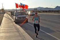 Horace Langford Jr./Pahrump Valley Times A runner representing the Royal Canadian Mounted Polic ...