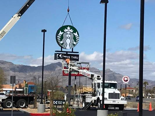 Terri Meehan/Special to the Pahrump Valley Times A sign was raised at the new Starbucks locatio ...