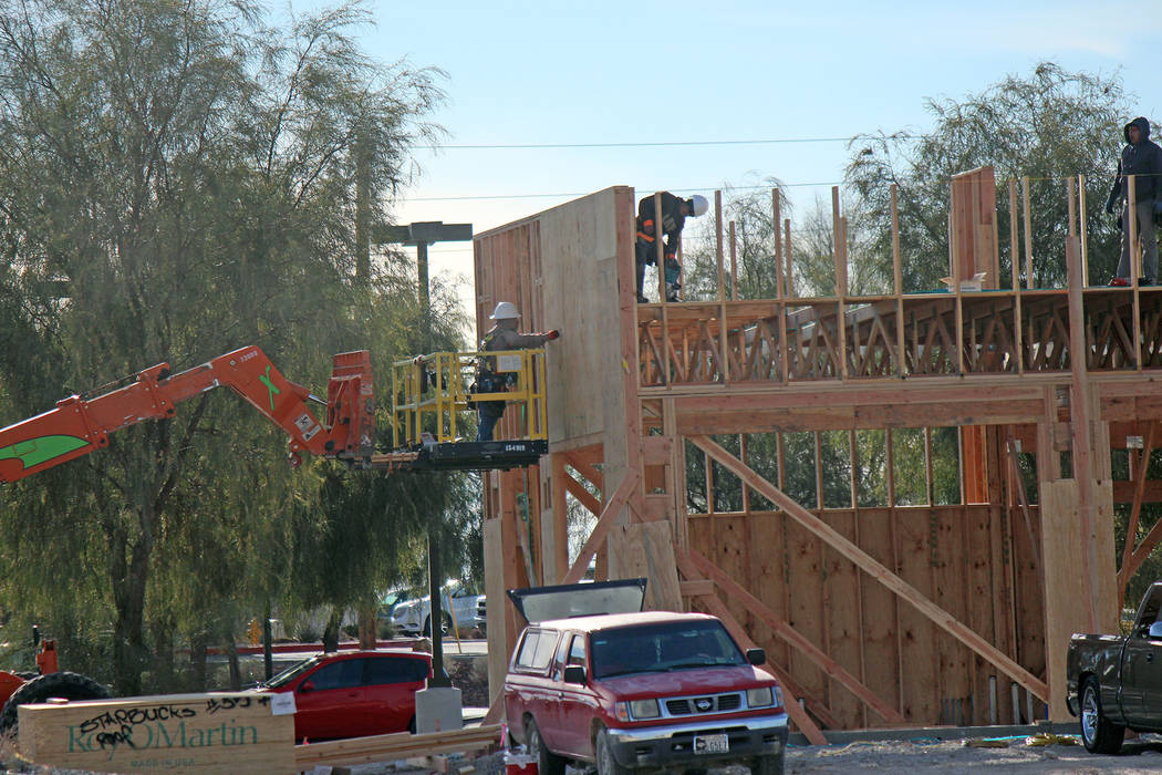 Jeffrey Meehan/Pahrump Valley Times A construction crew works on the future site of a Starbucks ...