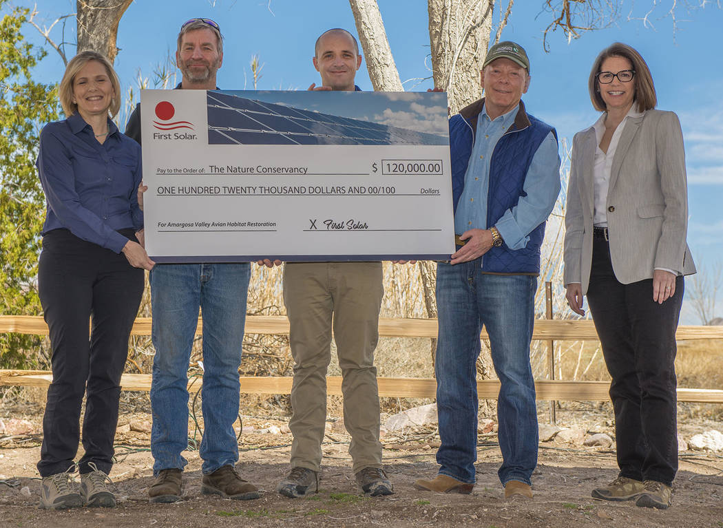 Chip Carroon / Special to the Pahrump Valley Times First Solar presents a check for habitat pr ...