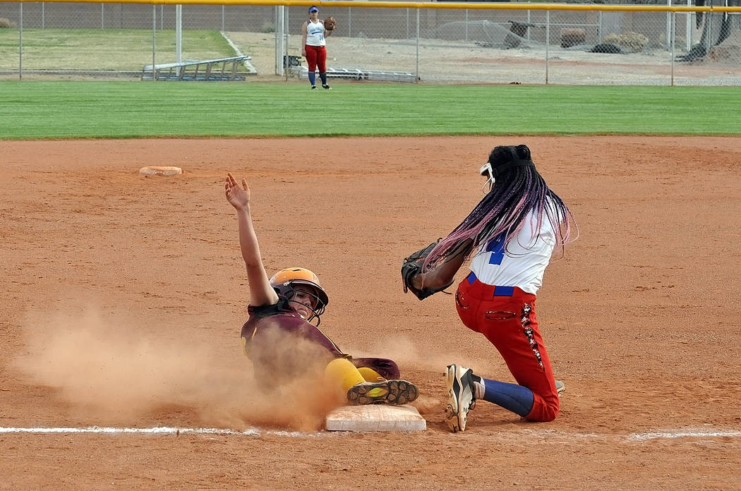 Horace Langford Jr./Pahrump Valley Times Kaden Cable slides safely into third base during Pahru ...