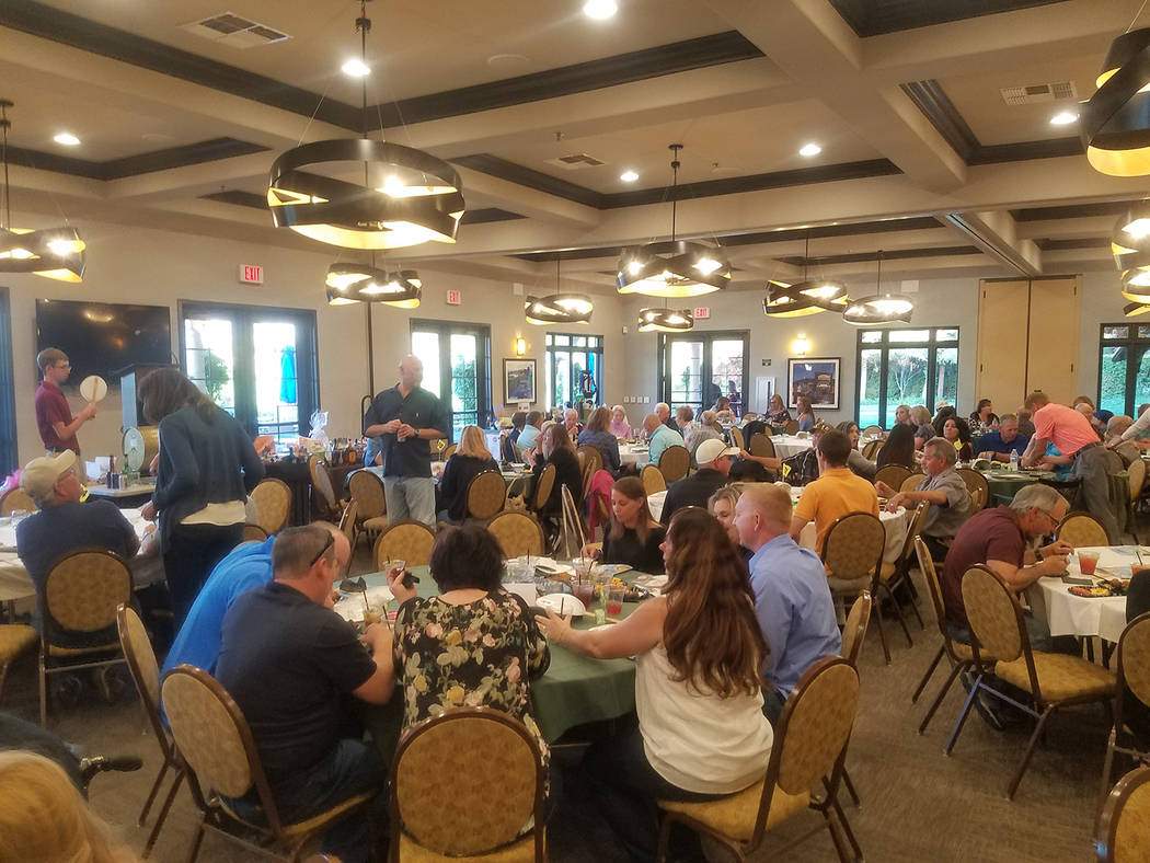 David Jacobs/Pahrump Valley Times The crowd gathers in the Mountain Falls Golf Club Grill Room ...