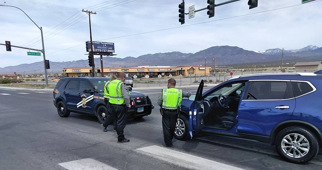 Selwyn Harris/Pahrump Valley Times NHP Troopers await the arrival of a tow truck at the interse ...