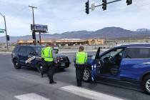 Selwyn Harris/Pahrump Valley Times NHP Troopers await the arrival of a tow truck at the interse ...