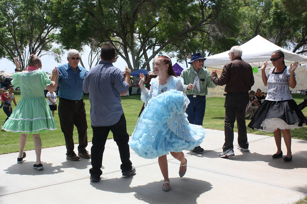 Robin Hebrock/Pahrump Valley Times The Desert Squares square dance group performed for the crow ...