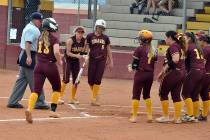 Horace Langford Jr./Pahrump Valley Times Jackie Stobbe is greeted by teammates at home plate af ...