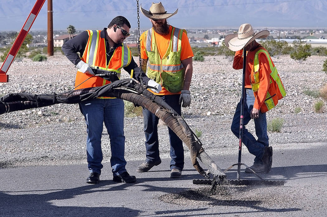 Horace Langford Jr./Pahrump Valley Times Nye County Commissioner Leo Blundo is pictured filling ...