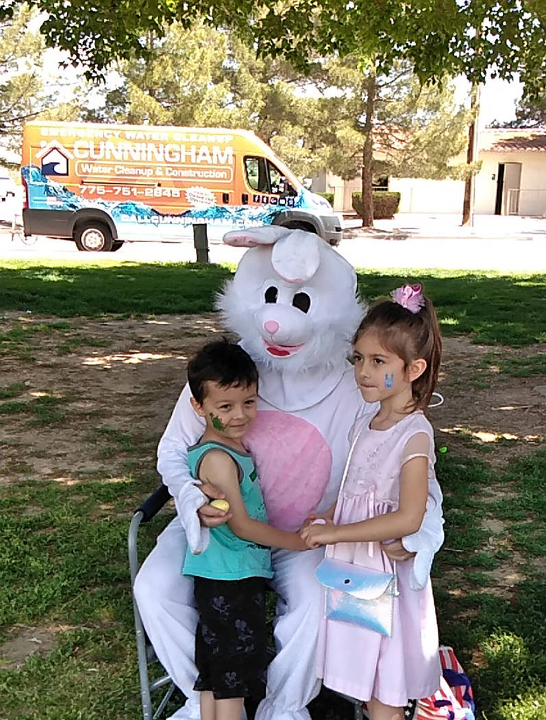 Selwyn Harris/Pahrump Valley Times Two youngsters spend some quality time with the Easter Bunny ...