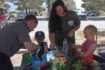 Robin Hebrock/Pahrump Valley Times Volunteers from the Home Depot spend time teaching youngster ...