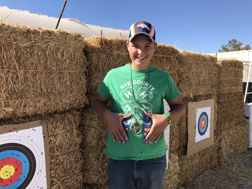 Jeffrey Meehan/Pahrump Valley Times Augustes Domina holds his two blue ribbons from the 2018 Ne ...