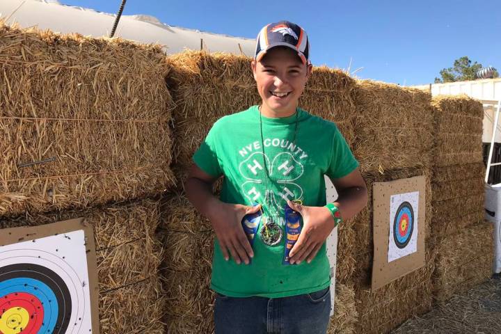 Jeffrey Meehan/Pahrump Valley Times Augustes Domina holds his two blue ribbons from the 2018 Ne ...