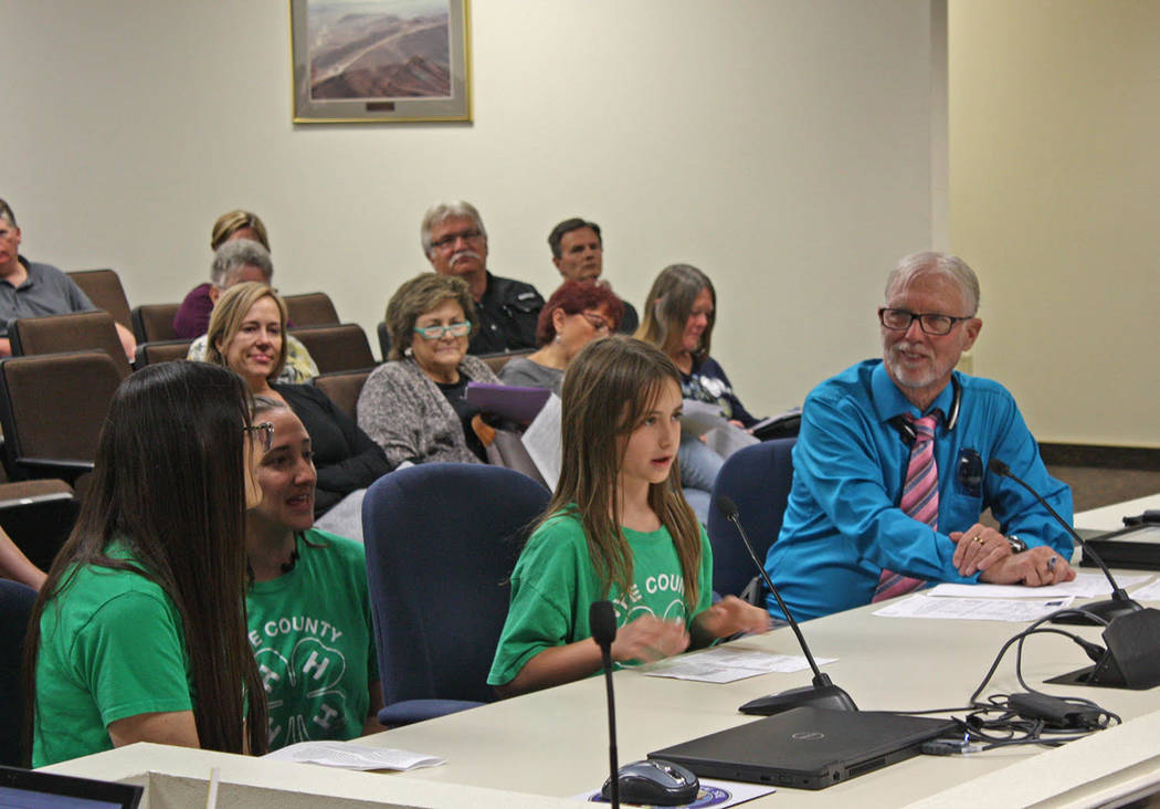 Robin Hebrock/Pahrump Valley Times 4H member Elaina Domina, second from right, speaks before th ...