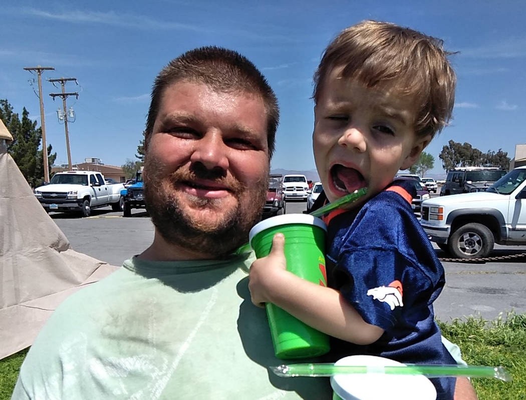 Selwyn Harris/Pahrump Valley Times Justice Evans and son Jake spent much of the day walking the ...