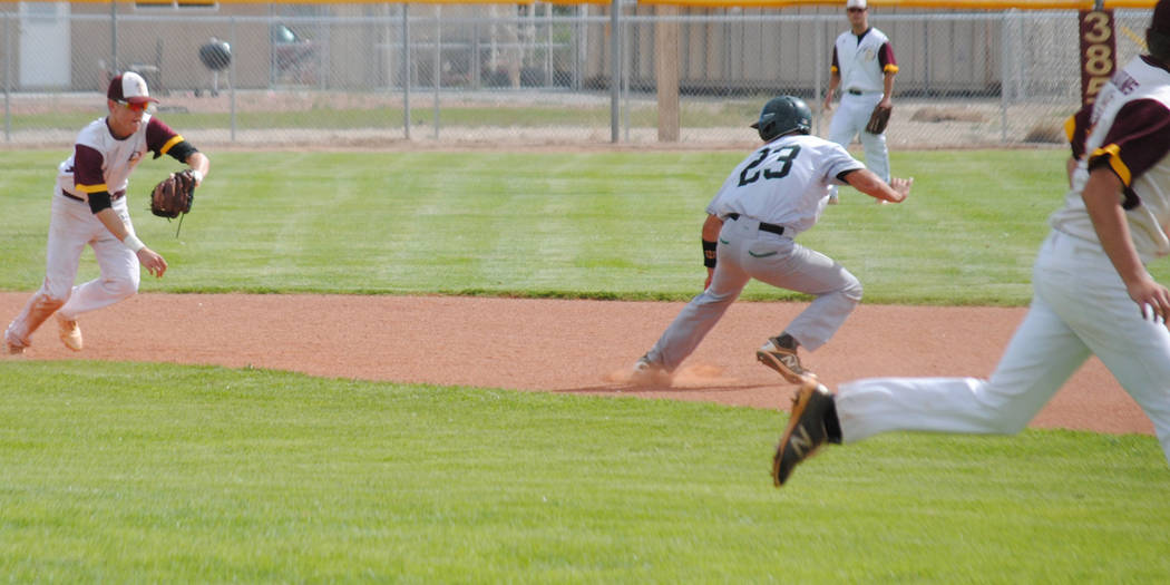 Charlotte Uyeno/Pahrump Valley Times Pahrump Valley's Chase McDaniel, left, chases Virgin Valle ...