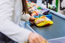 Getty Images Some stores limit the number of cashiers on real checkouts in order to drive peopl ...