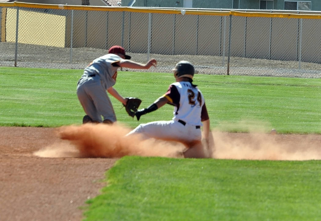 Horace Langford Jr./Pahrump Valley Times Senior Willie Lucas reaches second base in a cloud of ...