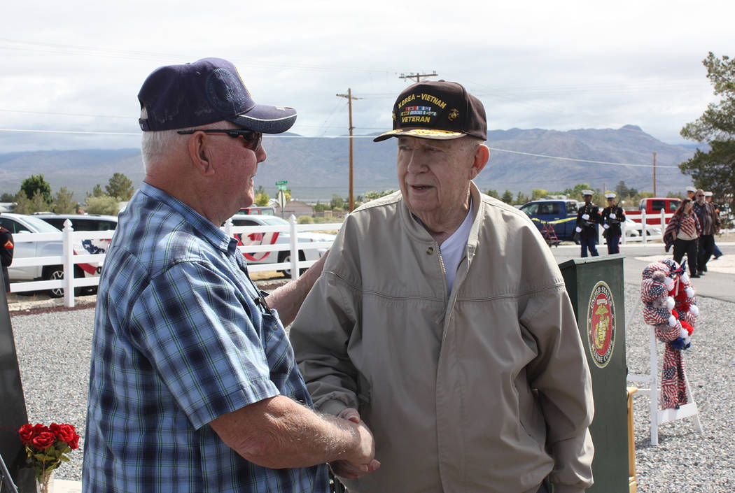 Robin Hebrock/Pahrump Valley Times Marine Corps Maj. Roger Chaput shakes hands with ceremony at ...